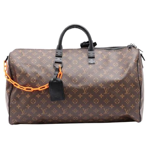 louis vuitton duffle bag orange chain|Louis Vuitton keepall line.